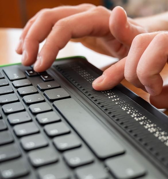 A person using a braille keyboard.
